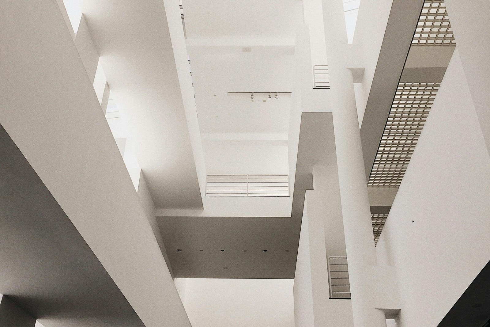 Low angle shot of a minimalist, modern interior with a person walking, great for architectural concepts.